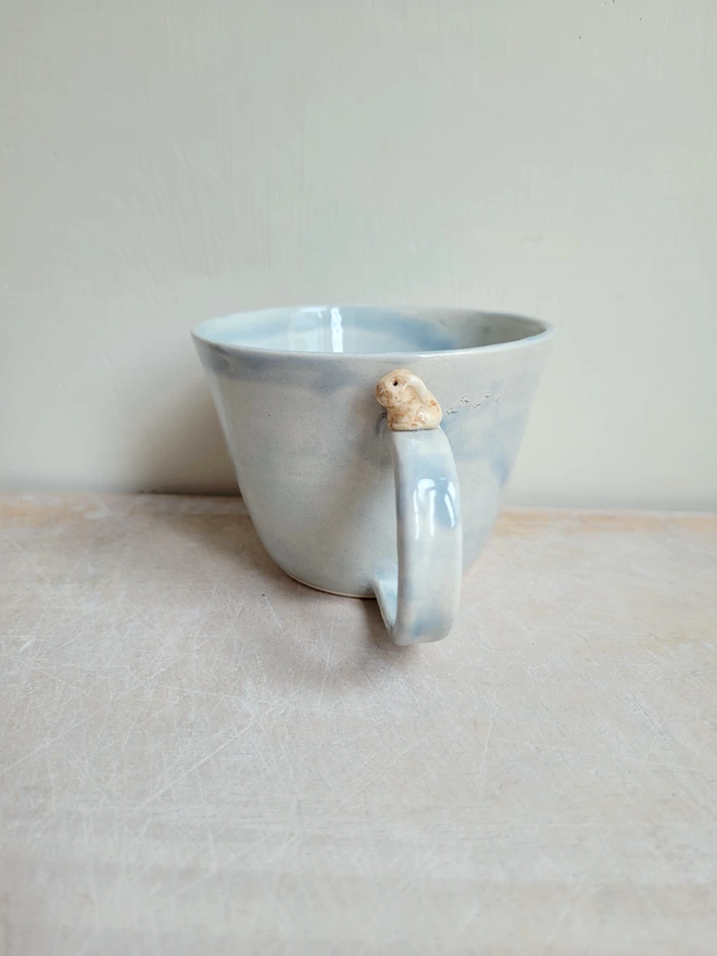 Handmade pottery bunny cup with rabbit foot prints 
