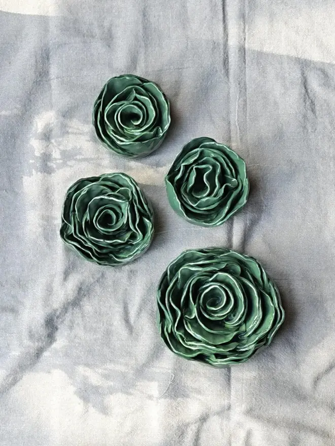 green ceramic rose sculptures