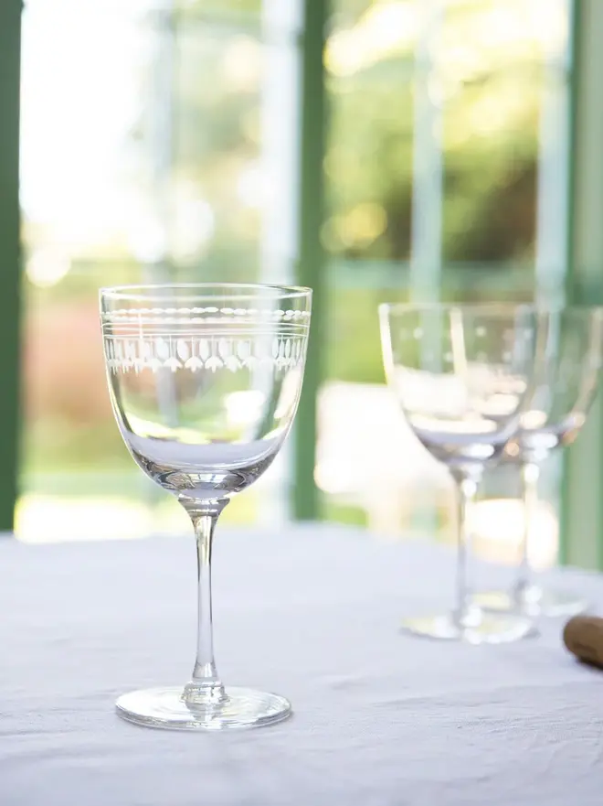 engraved ovals large crystal wine glasses. a large wine glass engraved with a delicate oval pattern.