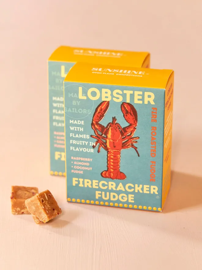 blue and yellow box of fudge with red lobster design