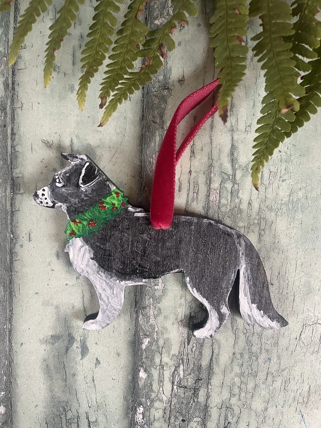 Border Collie handpainted Christmas tree decoration hung with red velvet ribbon