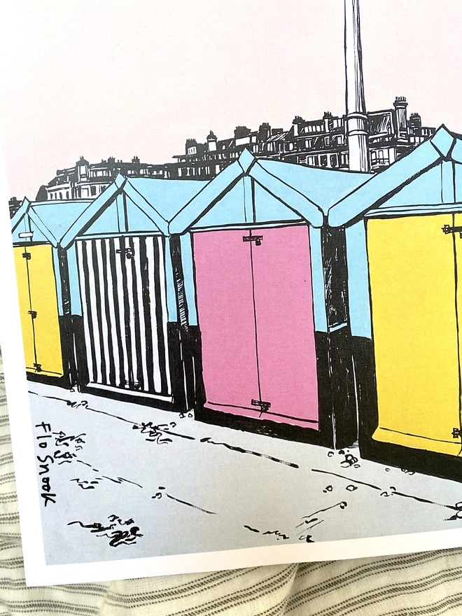 pink and yellow print of brighton hove beach huts 
