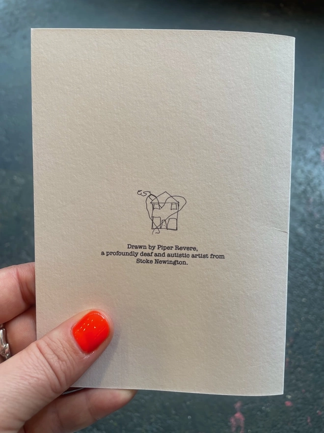 the back of the card with a logo piper has drawn and a description of her