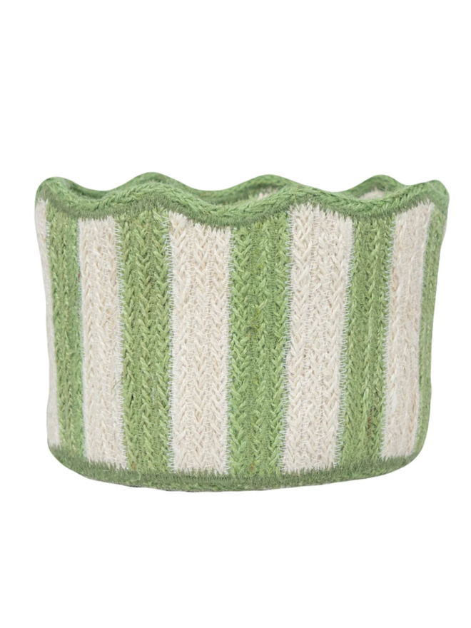 Green stripy scalloped organic jute basket on a white background.
