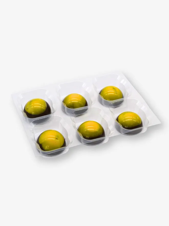 a tray of 6 luxury mango and calamansi dark chocolates