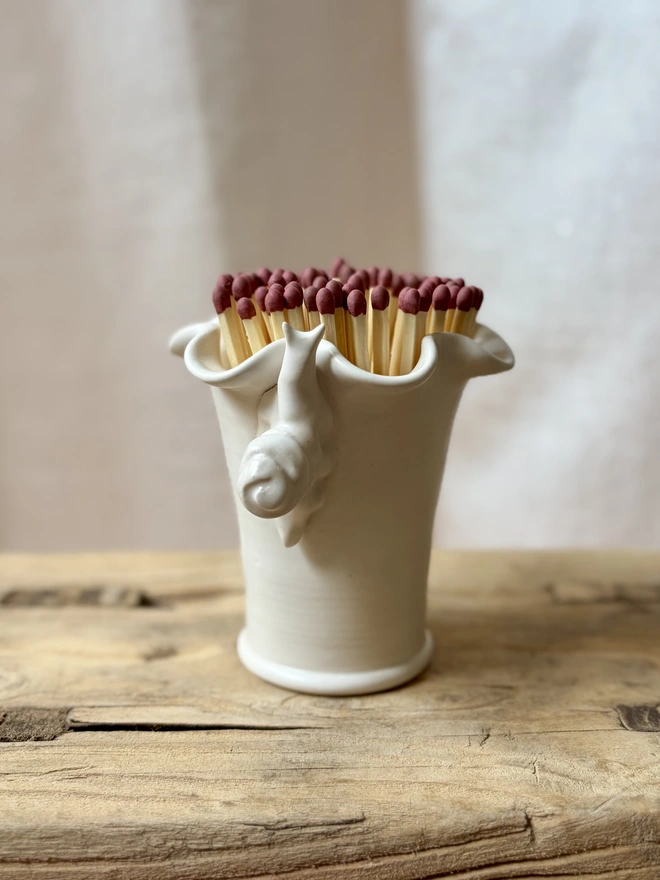 Ceramic match stick pot with hand sculpted snail
