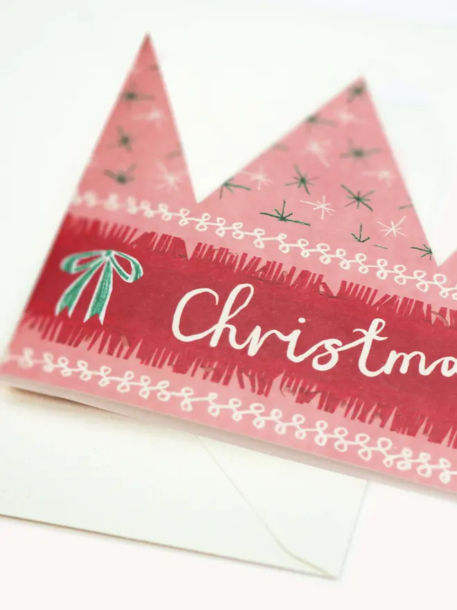 pink and red paper crown card with christmas fairy text