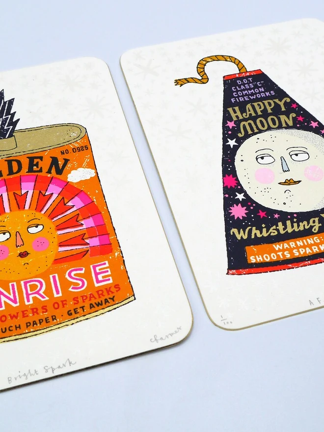 Sun And Moon Firework Screenprint Duo, a pair of colourful firework designs in the centre of white card. 
