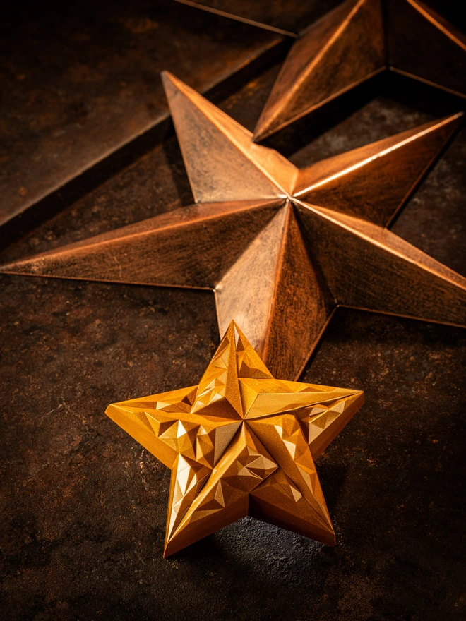 Shiny Golden Christmas star chocolate close up 