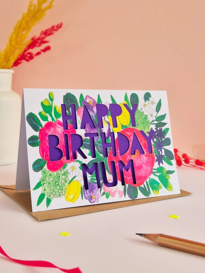 Bright floral illustration printed card with Happy Birthday Mum text and bright purple liner