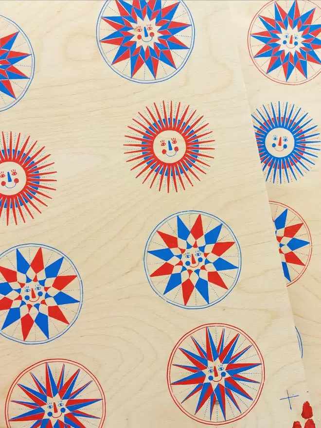 The four different designs can be seen screen printed on sheets of plywood. They need cutting out