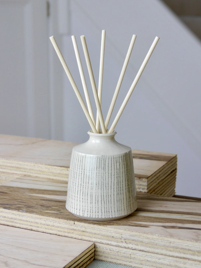 White Ceramic Reed Diffuser with hand-drawn line details