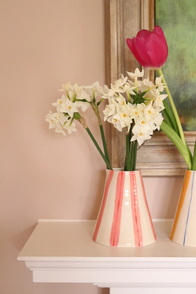 stripey vase with daffodils in