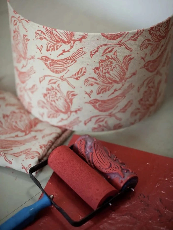Flock Patterned Paint Roller, painting lampshade with pink and white pattern. 