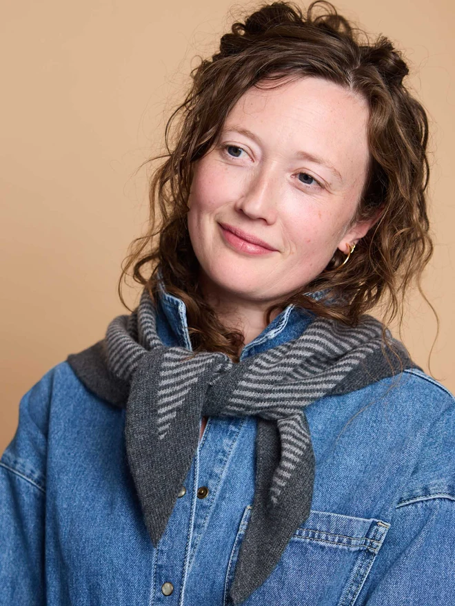woman wearing grey stripe wool neckerchief