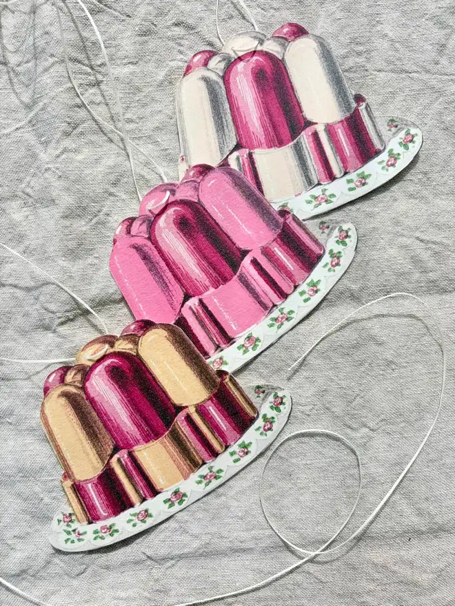 A string of jelly shaped bunting in fruit salad colours