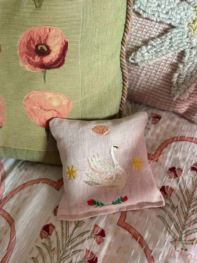 Swan Lavender Sachet. A sachet patterned with seashells and a swan.