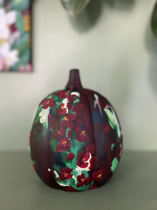 hand painted ceramic pumpkin deep rich red with vibrant quince flower