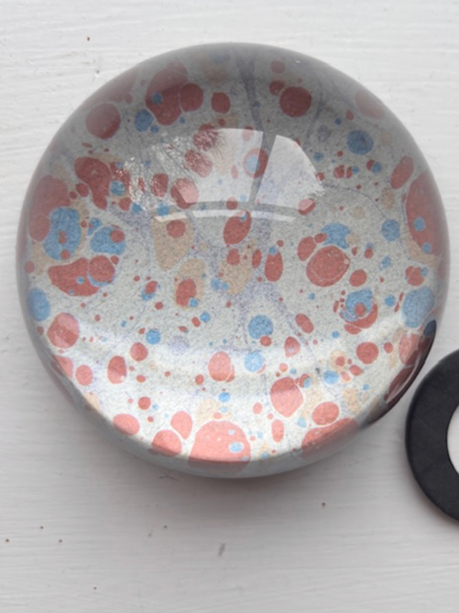 Large Paperweight. A paperweight in G.