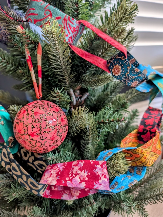 colourful fabric chain on tree
