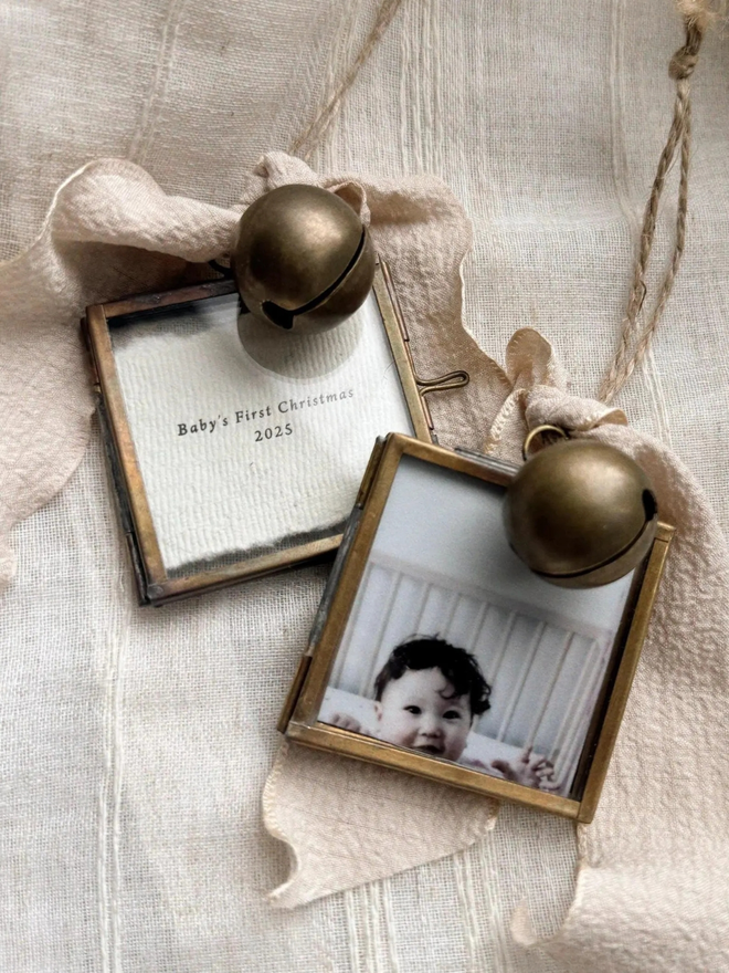Personalised baby's first Christmas hanging frame. Letterpress printed with a photograph in a bronze frame.