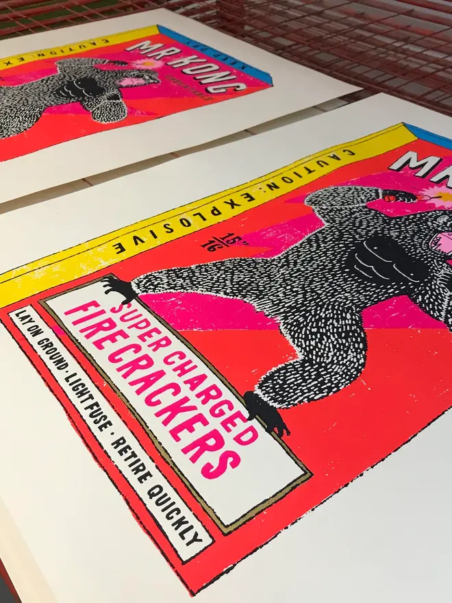 King Kong Screen Print The Magnificent Mr Kong, a pair of colourful screen prints placed on a studio table. 