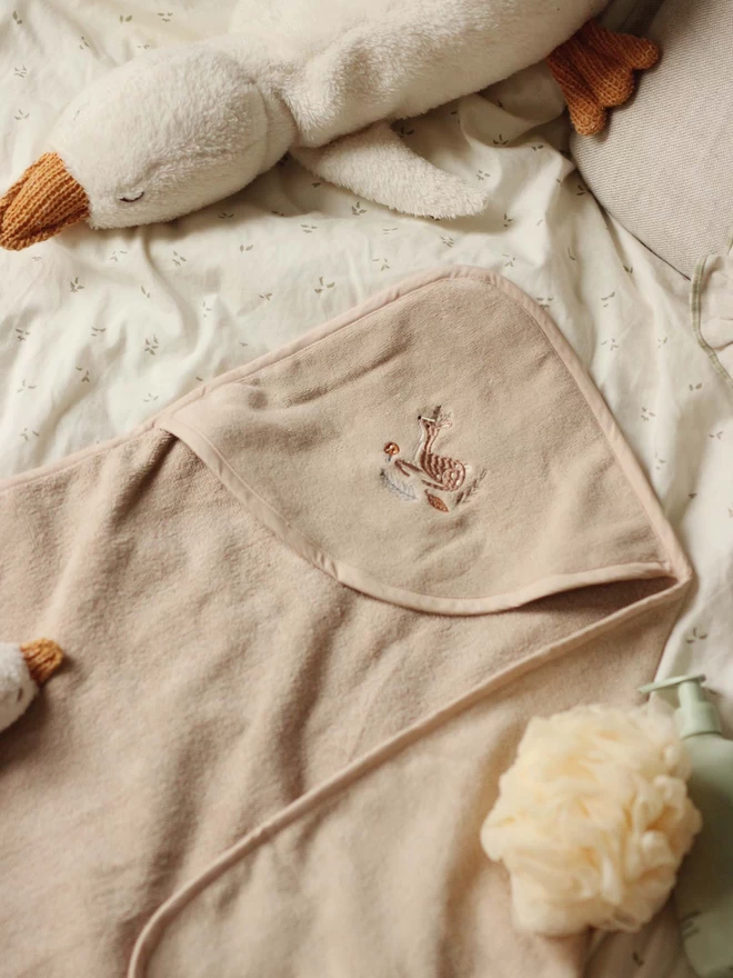 A cute hooded towel baby embroidered with deer