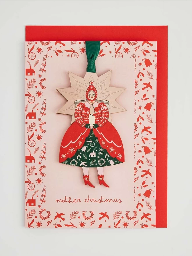 Mother Christmas Glow Up decoration on a pink card with a red envelope 