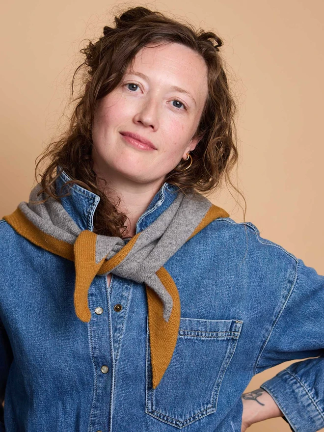 woman wearing grey and mustard wool neckerchief