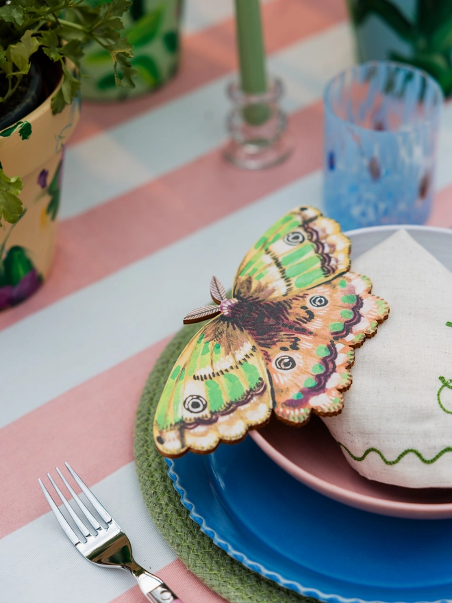 wooden emperor moth wall decoration. green wooden moth, adding to the place setting 