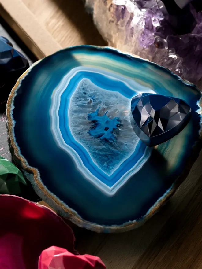 Blue heart chocolate on blue crystal plate