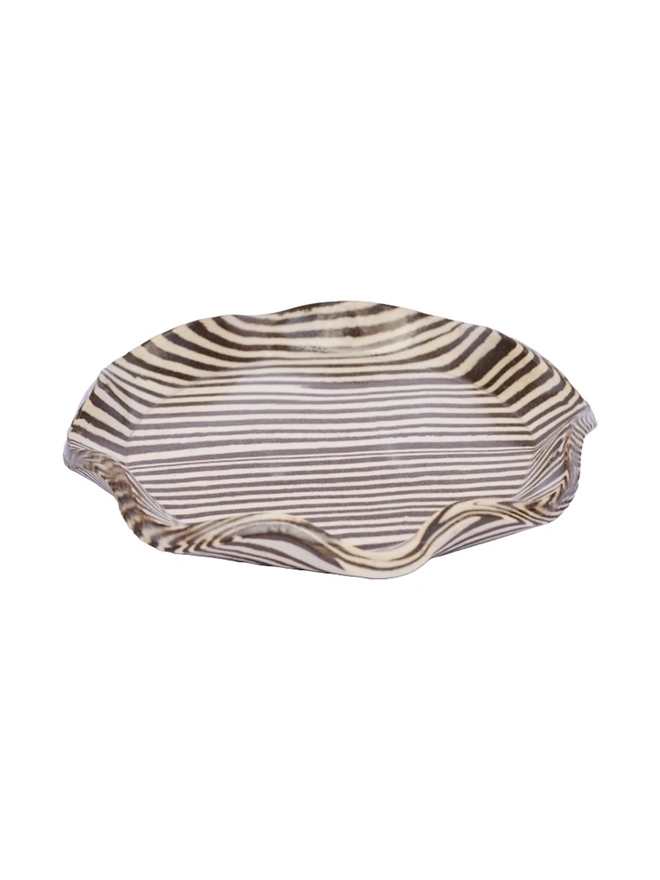 Striped Trinket Dish, a colourful trinket dish sitting on a white surface against a plain backdrop.