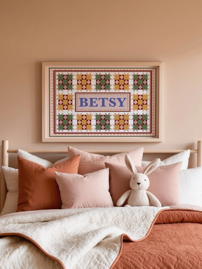 Custom name wall art featuring personalised patchwork print with a child's name taking centre stage, perfect for nursery and children's bedroom decor