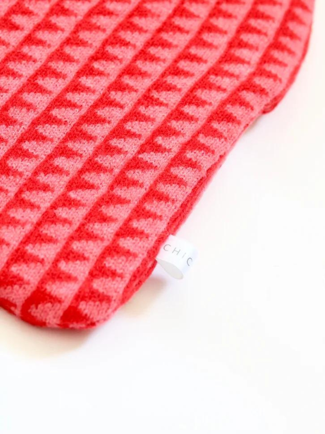 pink and red lambswool hot water bottle