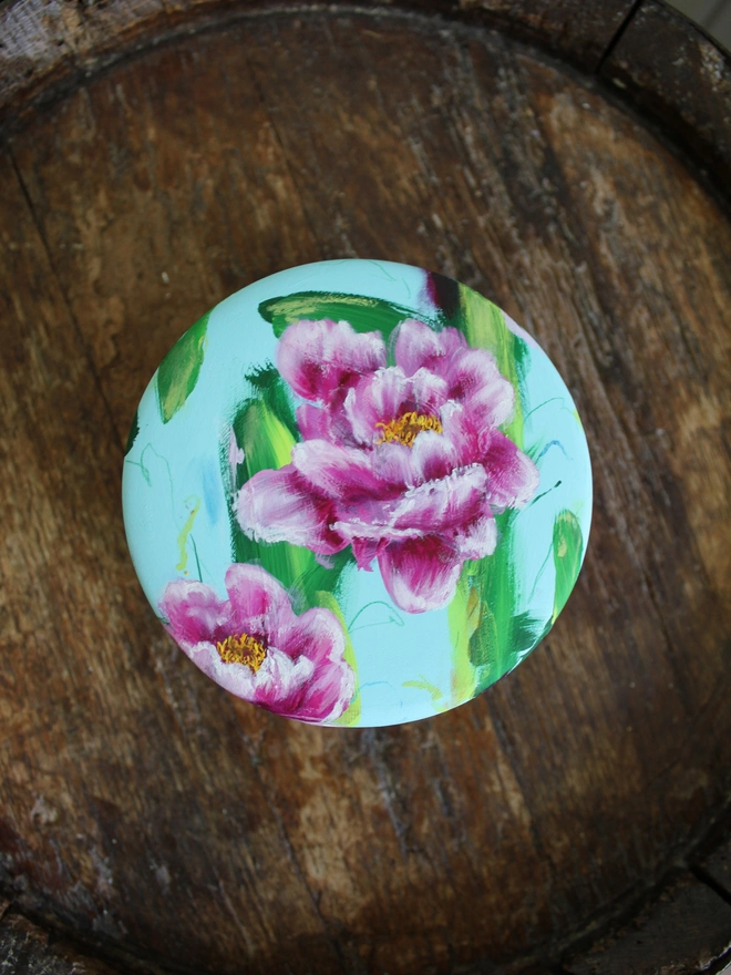 hand painted floral ceramic keepsake box background in a pale blue with pink peony flowers