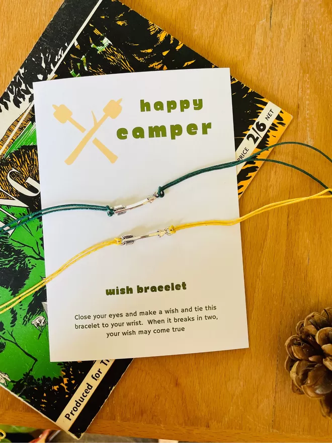 Happy camper arrow wish bracelet with it's gift card.