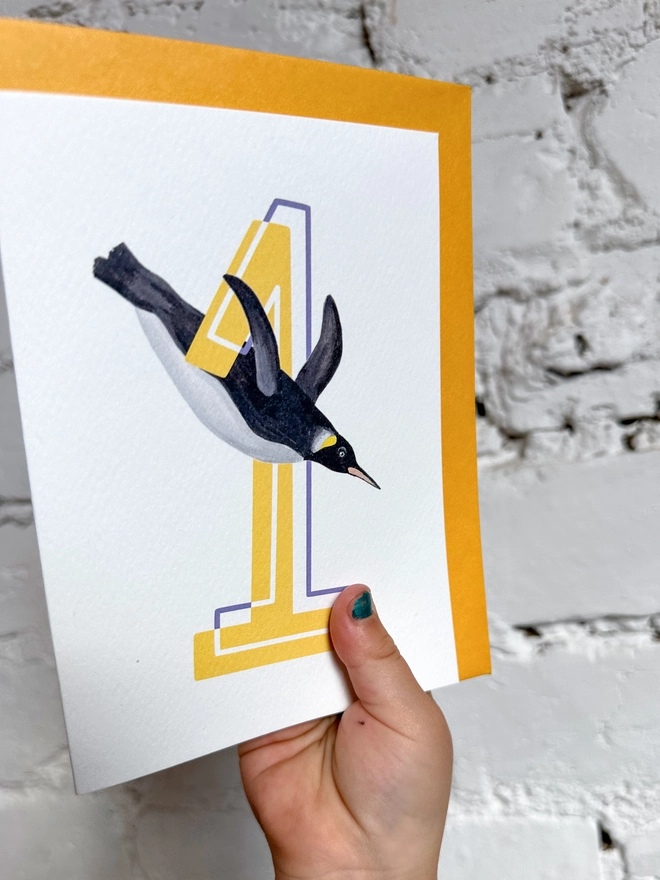 a white card with a big yellow number 1 and illustrated penguin with a bright yellow envelope