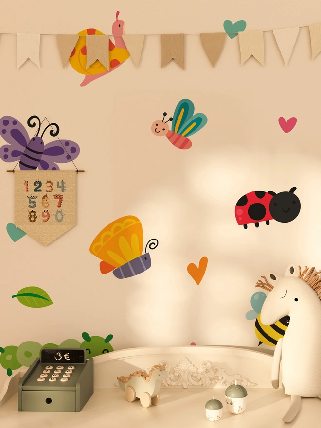 Colorful mini bug wall stickers featuring butterflies, ladybugs, bees, and other insects, perfect for decorating kids' rooms, nurseries, and playrooms.