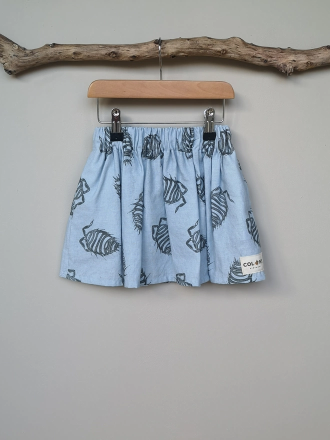 Girls Cotton Linen Soft Blue Woodlouse Print Skirt. Elasticated Waist and Side Seam Pockets.