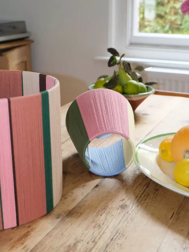 Lifestyle image of Pink and Putty lampshade on table