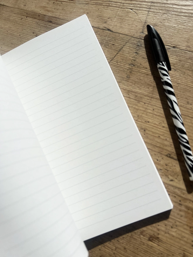 Inside our notebook showing the lined pages.