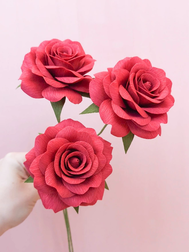 3 red crepe paper roses