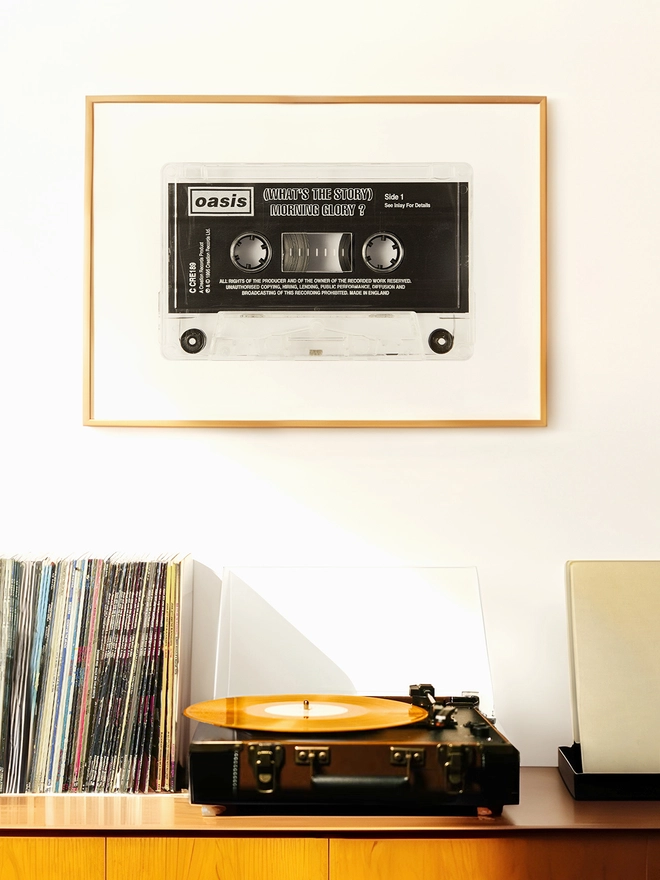 oasis whats the story morning glory cassette tape print. framed print hung up above record player and vinyl collection.