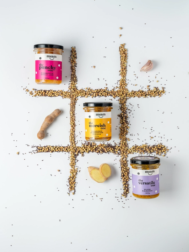 cheeseboard trio of jars on a noughts and crosses board