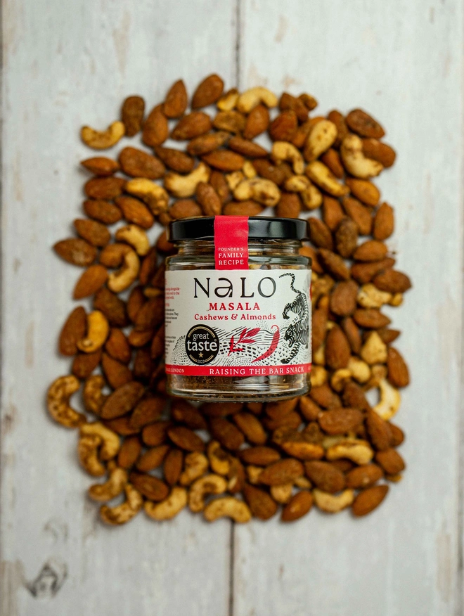 Masala Cashews & Almonds  displayed on a wooden table. 