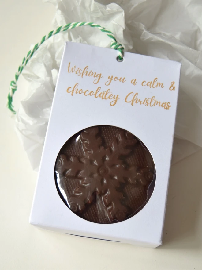 Calm Christmas handmade chocolate snowflake in stamped kraft bag with hanging twine