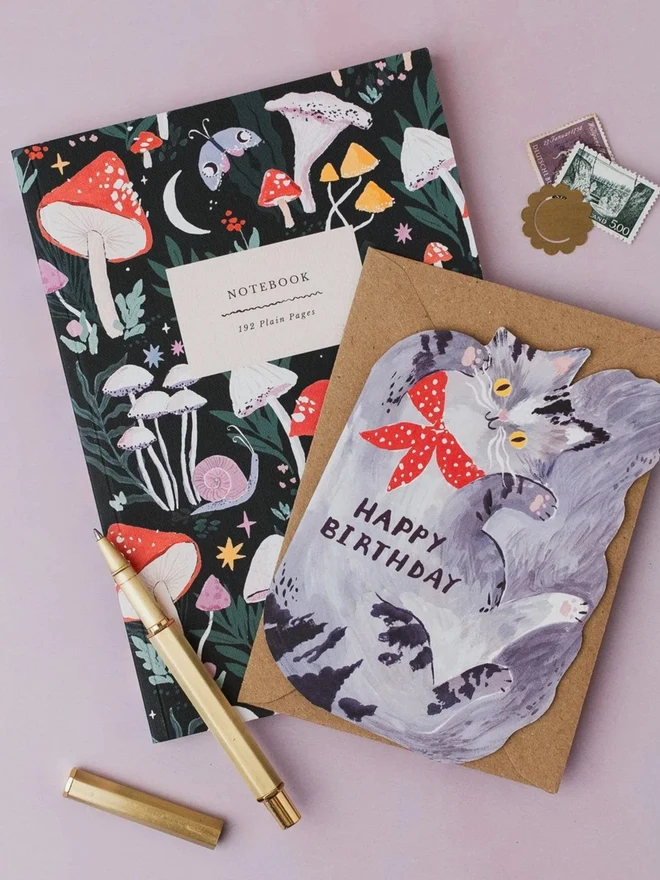 Mushrooms Notebook with a cat birthday card and gold pen