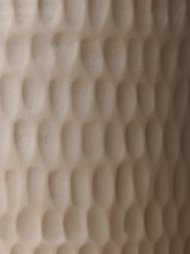 handmade textured oat coloured vase close up