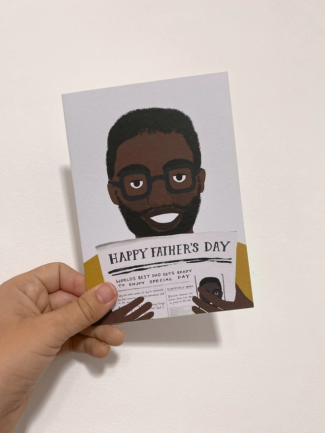 Fathers day card in hand