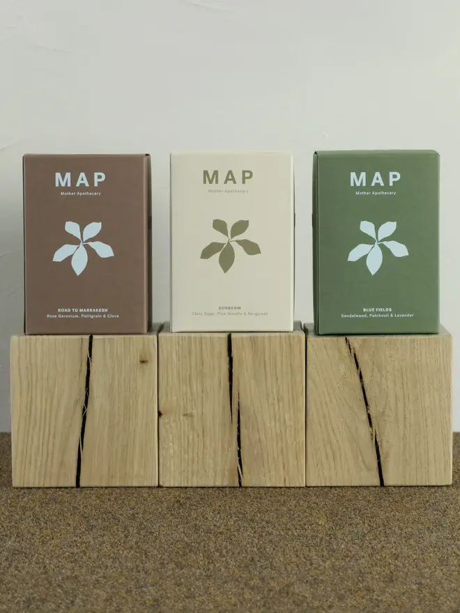 large aromatherapy soy wax candles (set of 3). candles pictured inside their boxes.